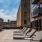 a patio with tables and chairs outside