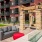 a brick building with a pool and a couch in front of it
