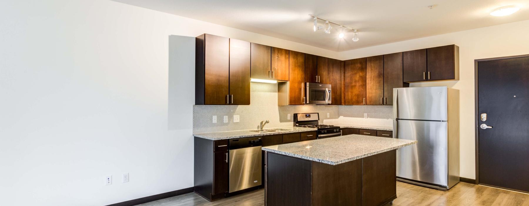 a kitchen with wooden cabinets