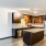 a kitchen with wooden cabinets