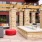 a courtyard with a fountain and a building in the background