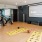 a room with exercise equipment and a screen