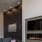 a room with a fireplace and couches