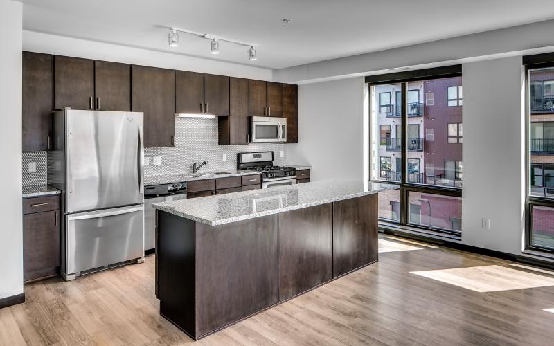 a kitchen with wooden cabinets